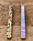 Angelco Accessories reversible paddle paper earrings - showing the colour on each side - pink blue or speckle