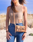 Angelco Accessories - Front pocket phone wallet crossbody cork bag - worn by model with sand dune background