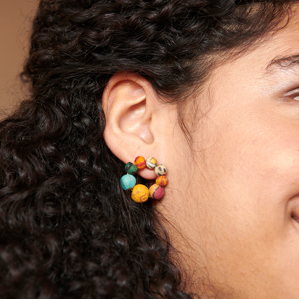 Angelco Accessories kantha ring stud as worn by model - close up view