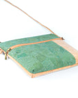 Angelco Accessories Katt crossbody bag with green metallic marbled panelling on white flatlay angled view