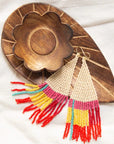 Angelco Accessories - Tri-tassel earrings - laid on wooden bowl and white cloth