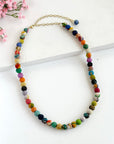 Angelco Accessories single strand kantha short necklace with pink flowers in background