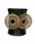 Angelco Accessories Colour burst circle earrings hanging on ceramic cup on white background - gold