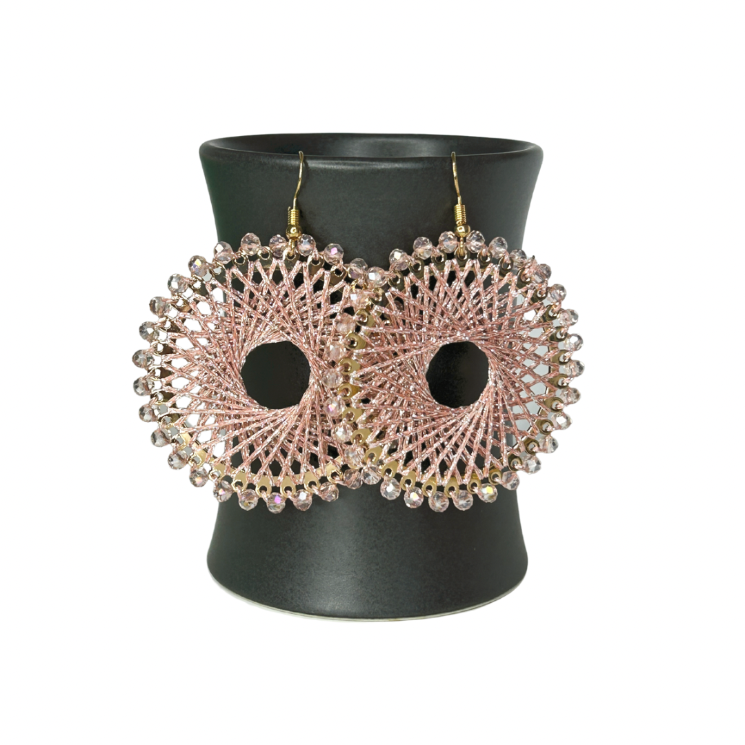 Angelco Accessories Colour burst circle earrings hanging on ceramic cup on white background - rose