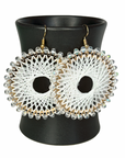 Angelco Accessories Colour burst circle earrings hanging on ceramic cup on white background - white