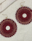 Angelco Accessories colour burst circle earrings on linen background - red