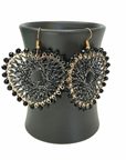 Angelco Accessories Colour burst heart earrings hanging on ceramic cup on white background - black silver