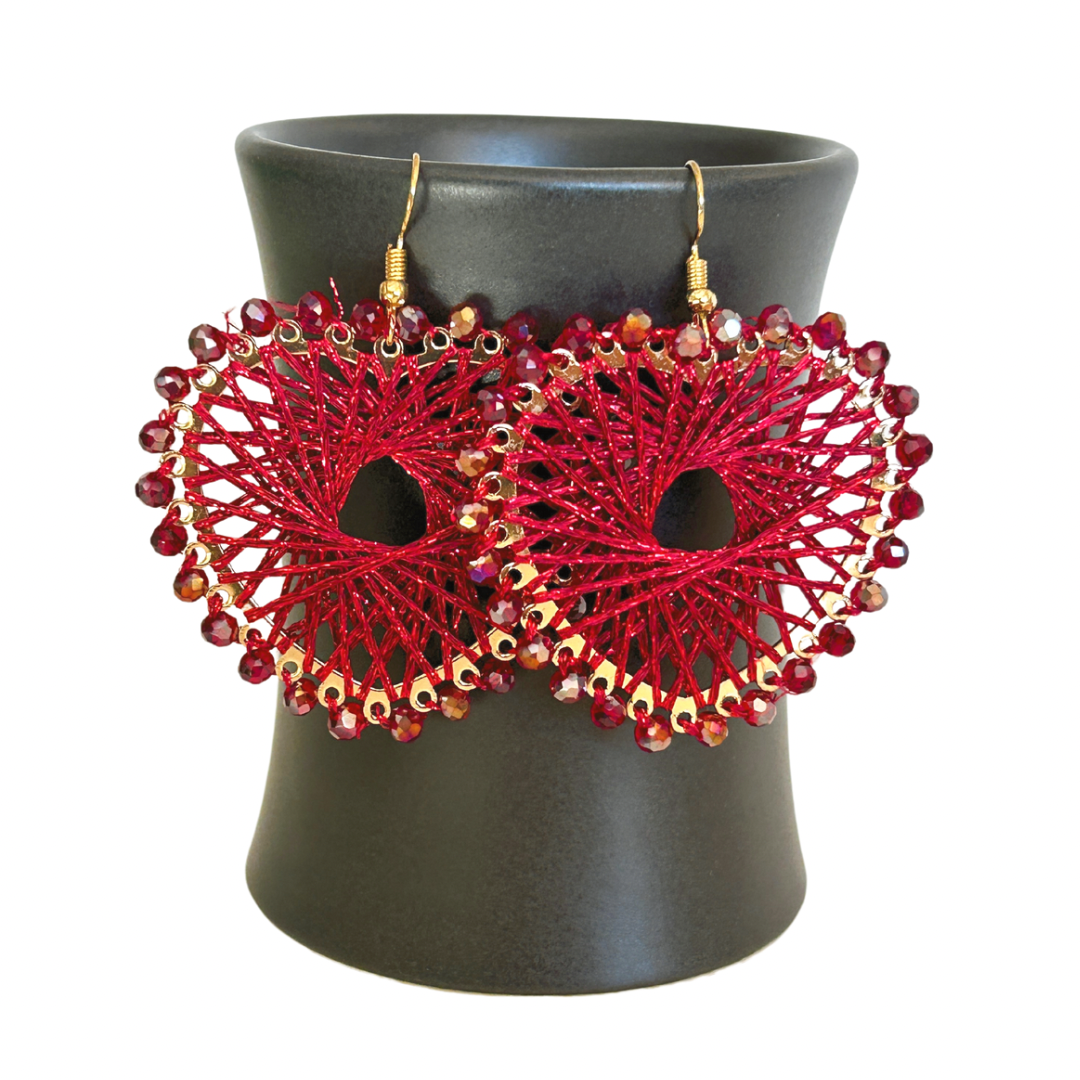 Angelco Accessories Colour burst heart earrings hanging on ceramic cup on white background - red