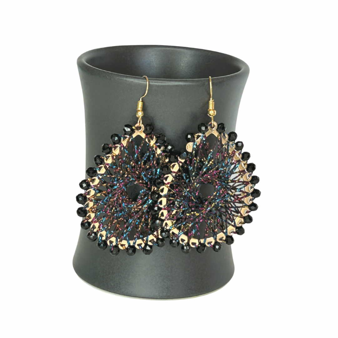 Angelco Accessories Colour burst teardrop earrings hanging on ceramic cup on white background - black colourful