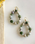 Angelco Accessories Teardrop kantha earrings - sea foam - flatlay with linen and small yellow flower