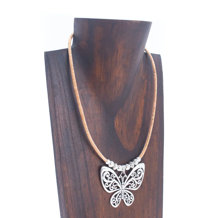 Angelco Accessories Butterfly pendant cork necklace displayed on wooden bust