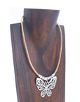 Angelco Accessories Butterfly pendant cork necklace displayed on wooden bust