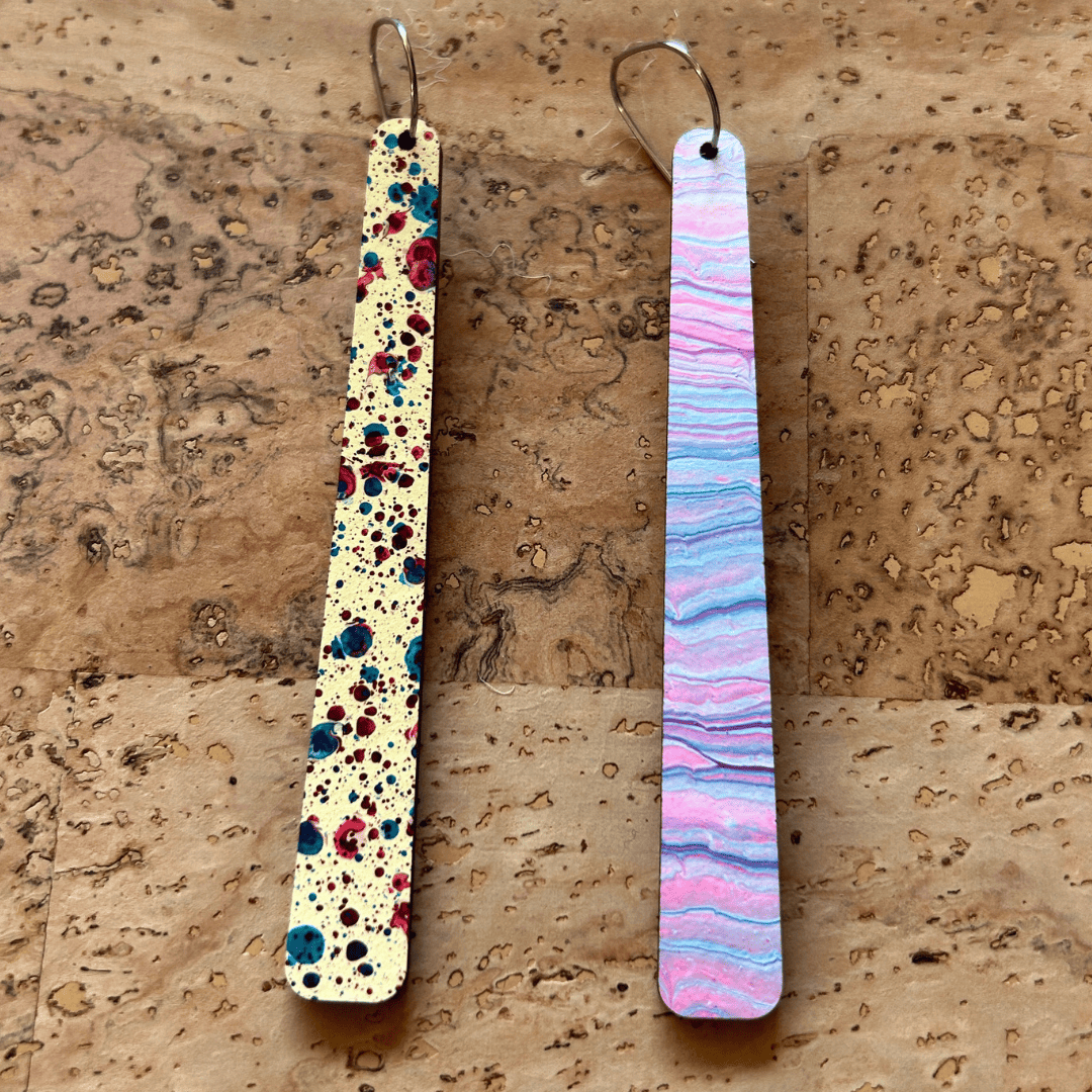 Angelco Accessories reversible paddle paper earrings - showing the colour on each side - pink blue or speckle