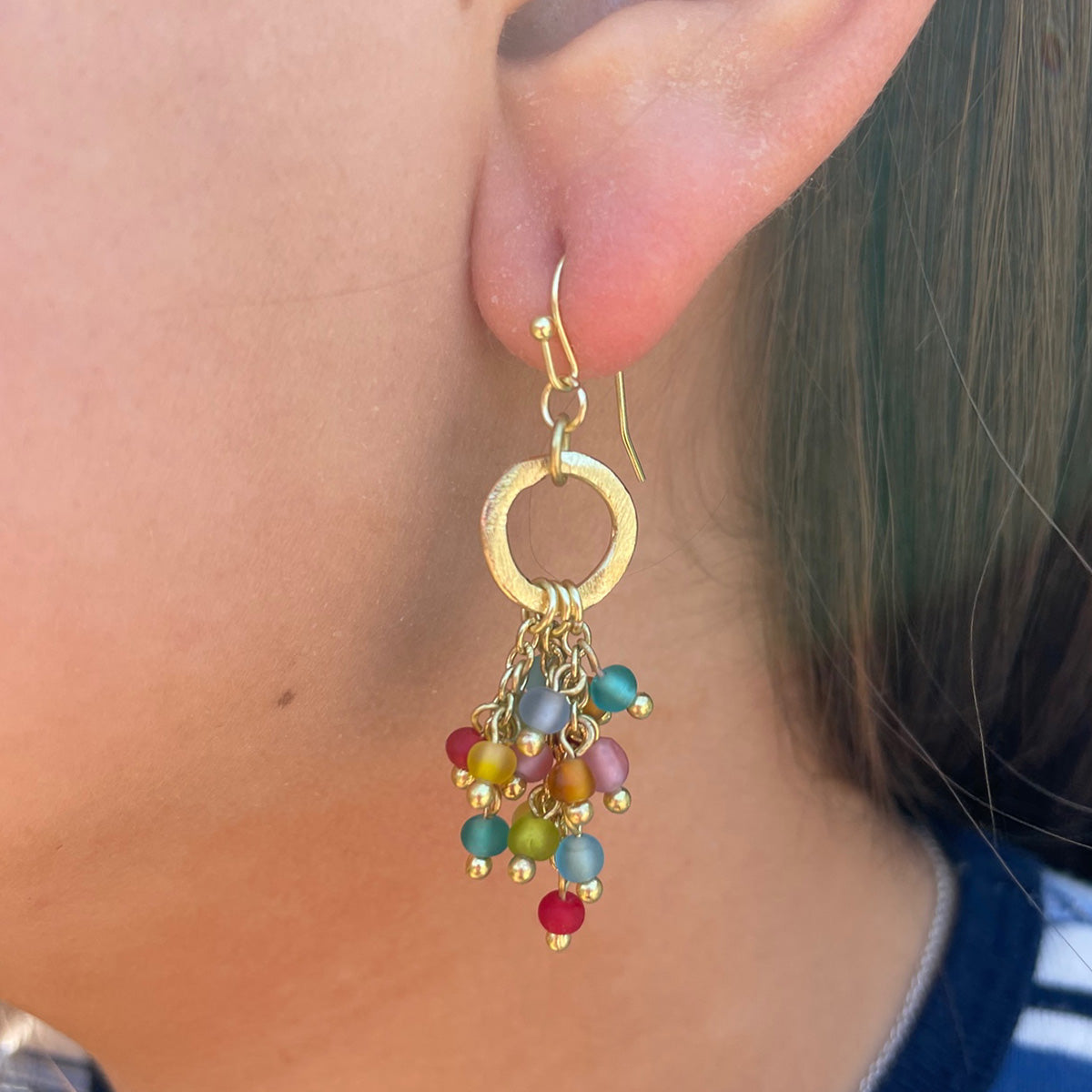 Angelco Accessories Treasure show hoop earrings  - close up worn by model