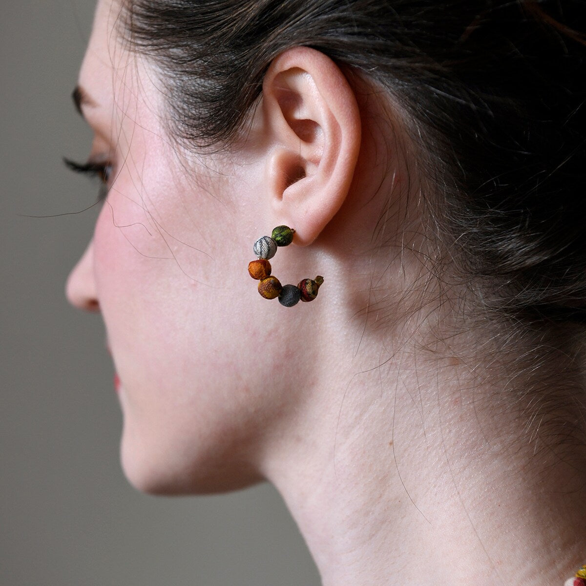 Kantha mini hoop stud earrings as worn by model to show size