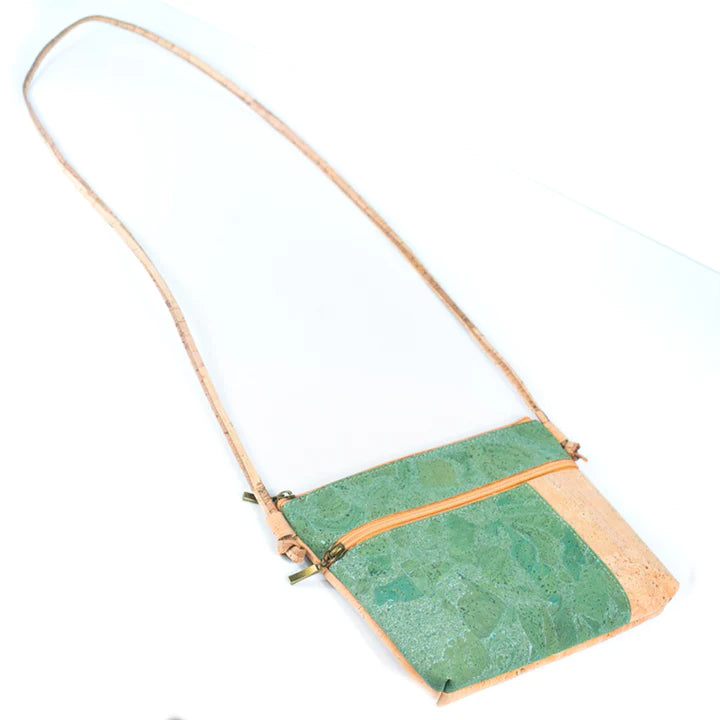 Angelco Accessories Katt crossbody bag with green metallic marbled panelling on a white background with strap extended