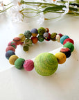 Angelco Accessories planet kantha bracelet in close view with flowers in background