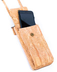 Angelco Accessories Riley phone wallet cork sling - view with phone in pocket on white background