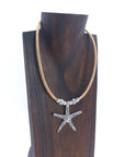 Angelco Accessories Starfish pendant cork necklace with silver coloured beads - displayed on wooden bust