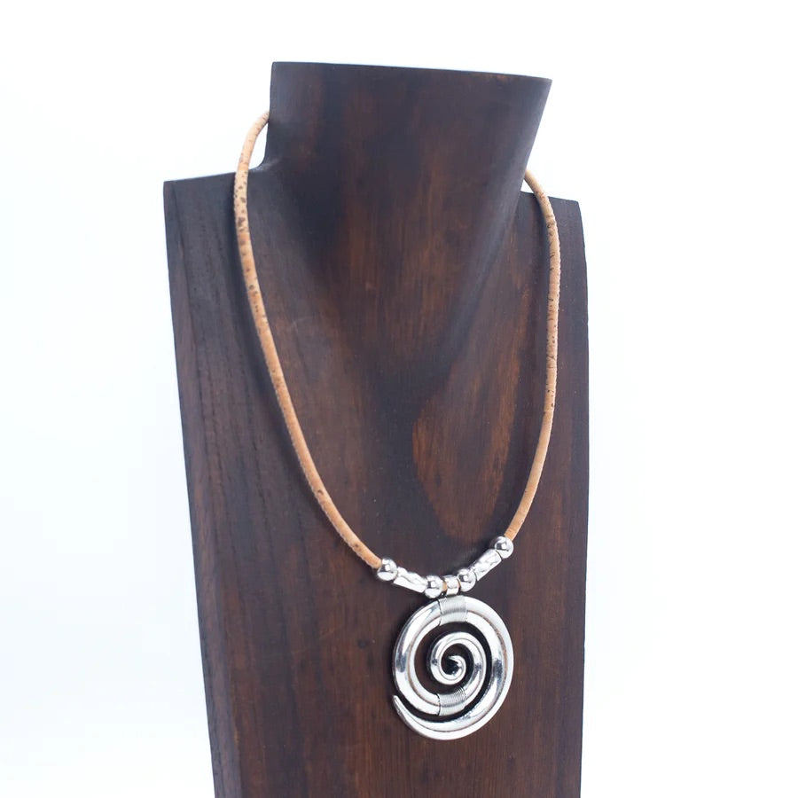 Angelco Accessories Swirl Cork Necklace on dark brown wooden bust