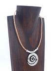 Angelco Accessories Swirl Cork Necklace on dark brown wooden bust