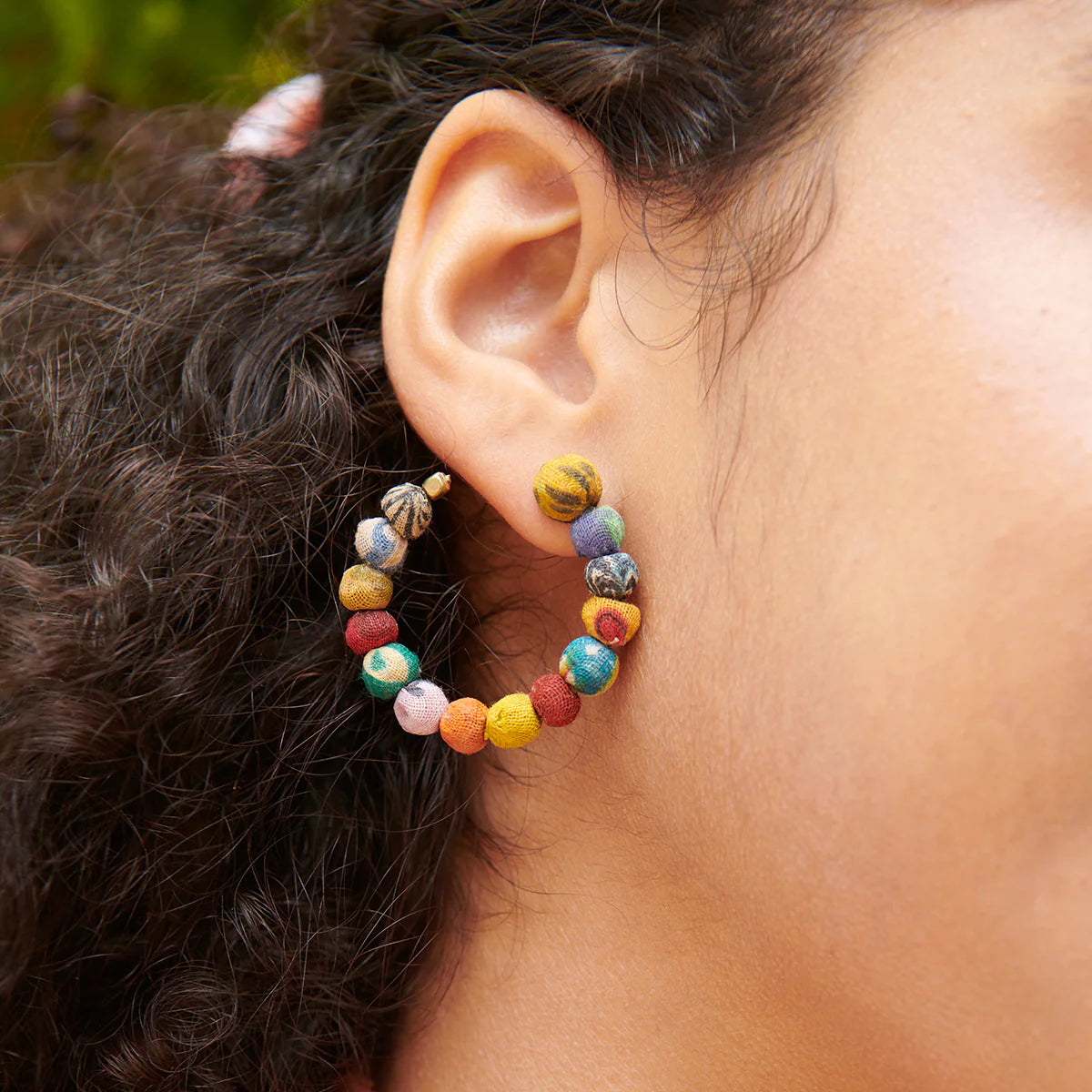 Angelco Accessories flatlay kantha hoop earrings  - close up worn by model