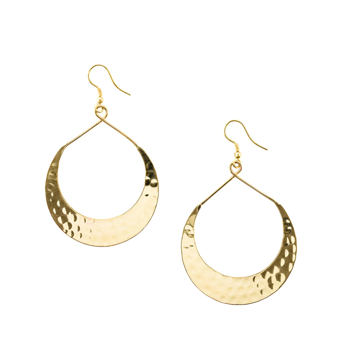 Gold crescent earrings on white flatlay