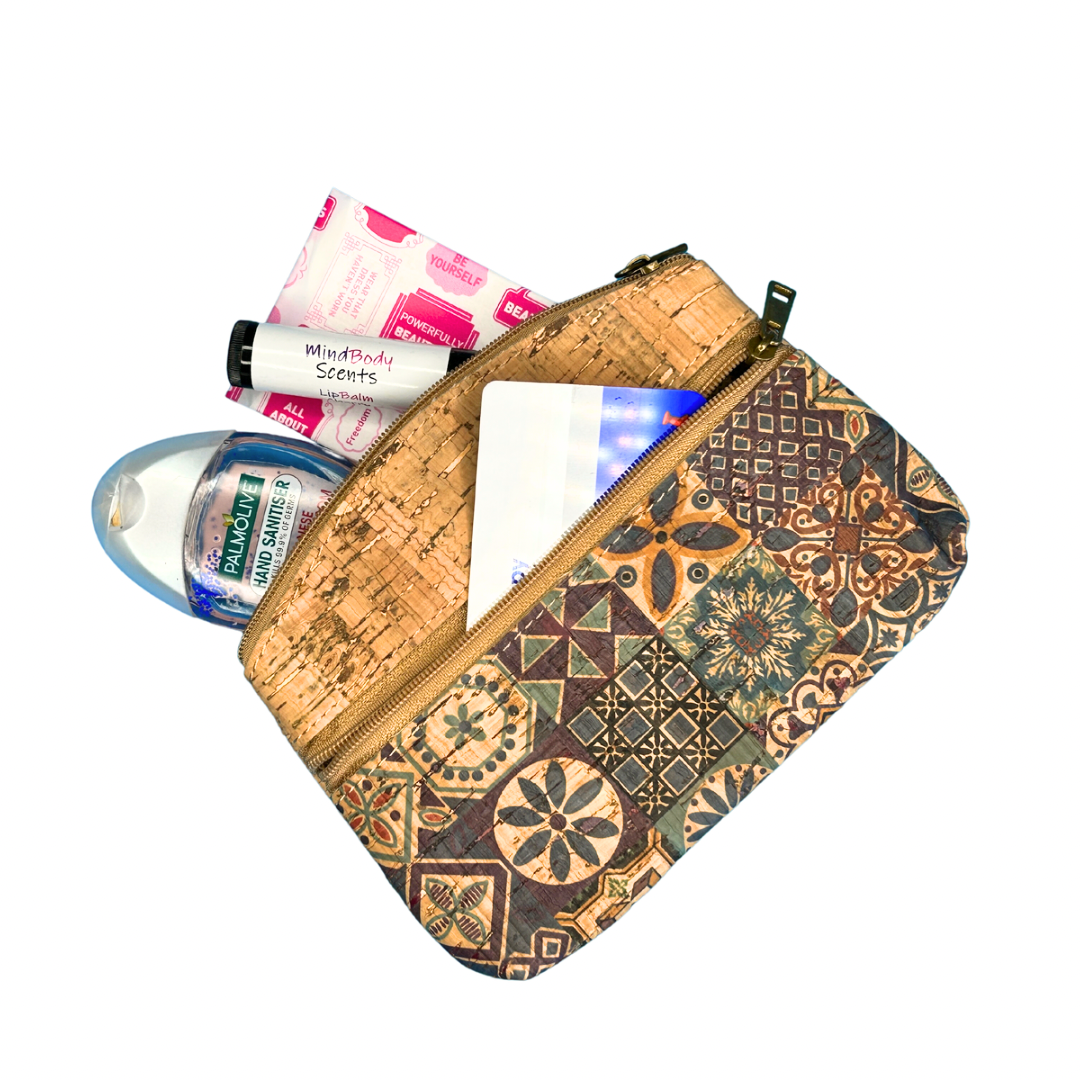 Angelco Accessories Petra cork purse in blue patchwork print on white flatlay with functional items shown half packed in purse