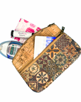 Angelco Accessories Petra cork purse in blue patchwork print on white flatlay with functional items shown half packed in purse