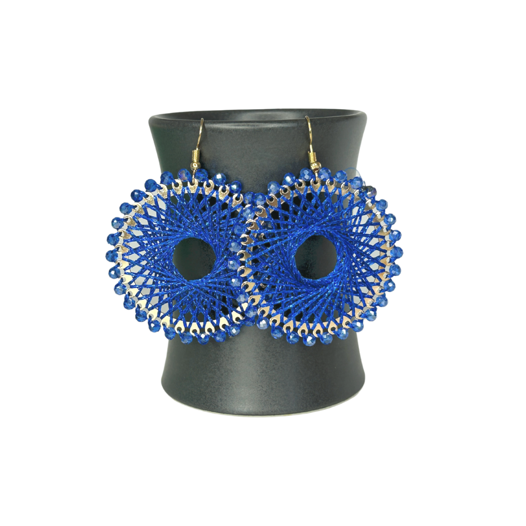 Angelco Accessories Colour burst circle earrings hanging on ceramic cup on white background - cobalt