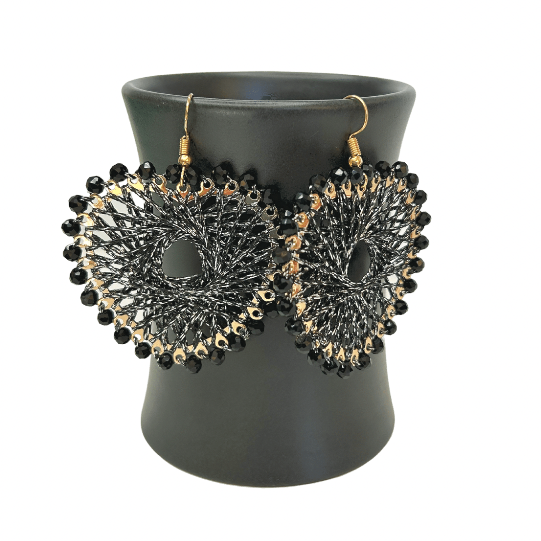 Angelco Accessories Colour burst heart earrings hanging on ceramic cup on white background - black silver