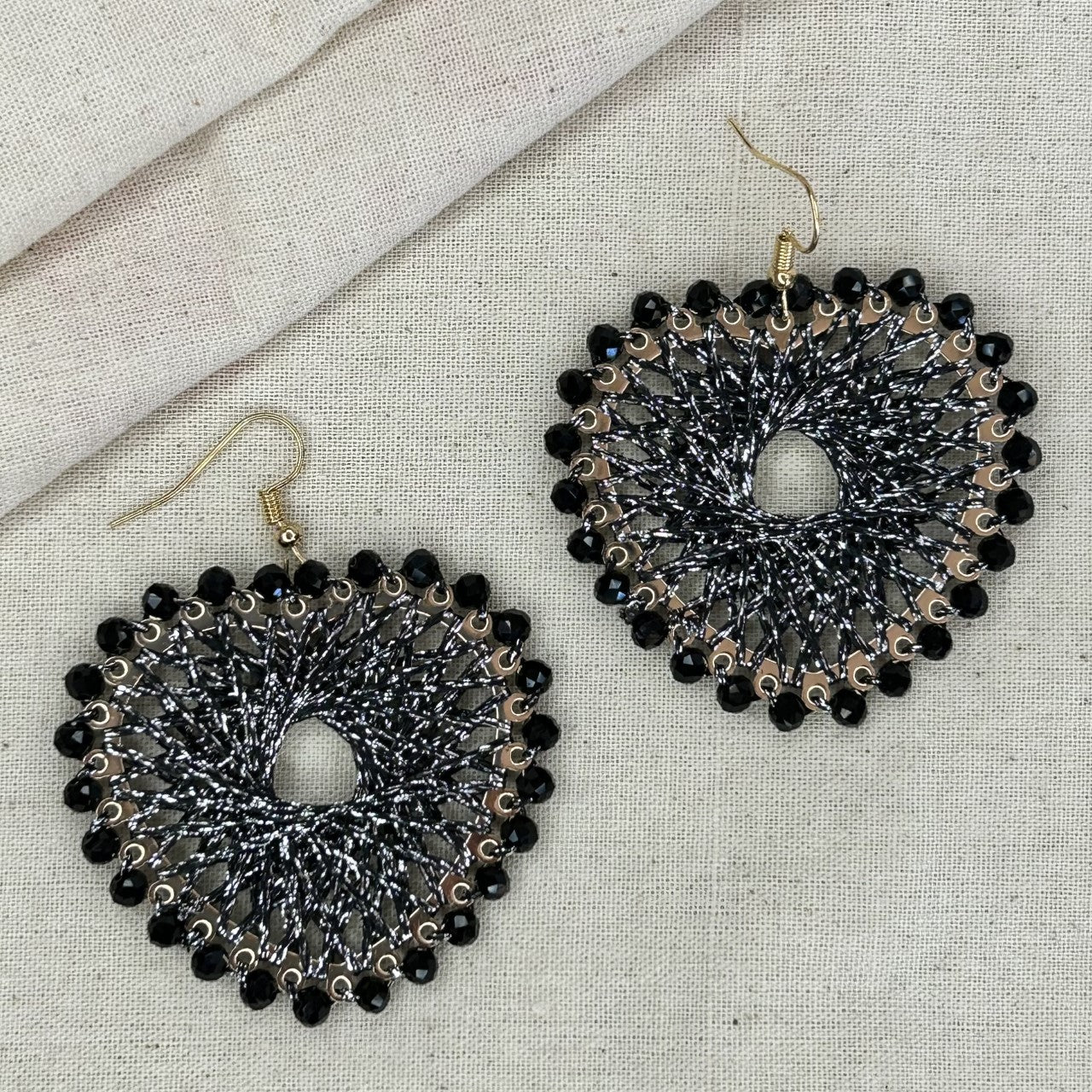 Angelco Accessories Colour burst heart earrings on linen background - black silver