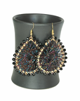 Angelco Accessories Colour burst teardrop earrings hanging on ceramic cup on white background - black colourful