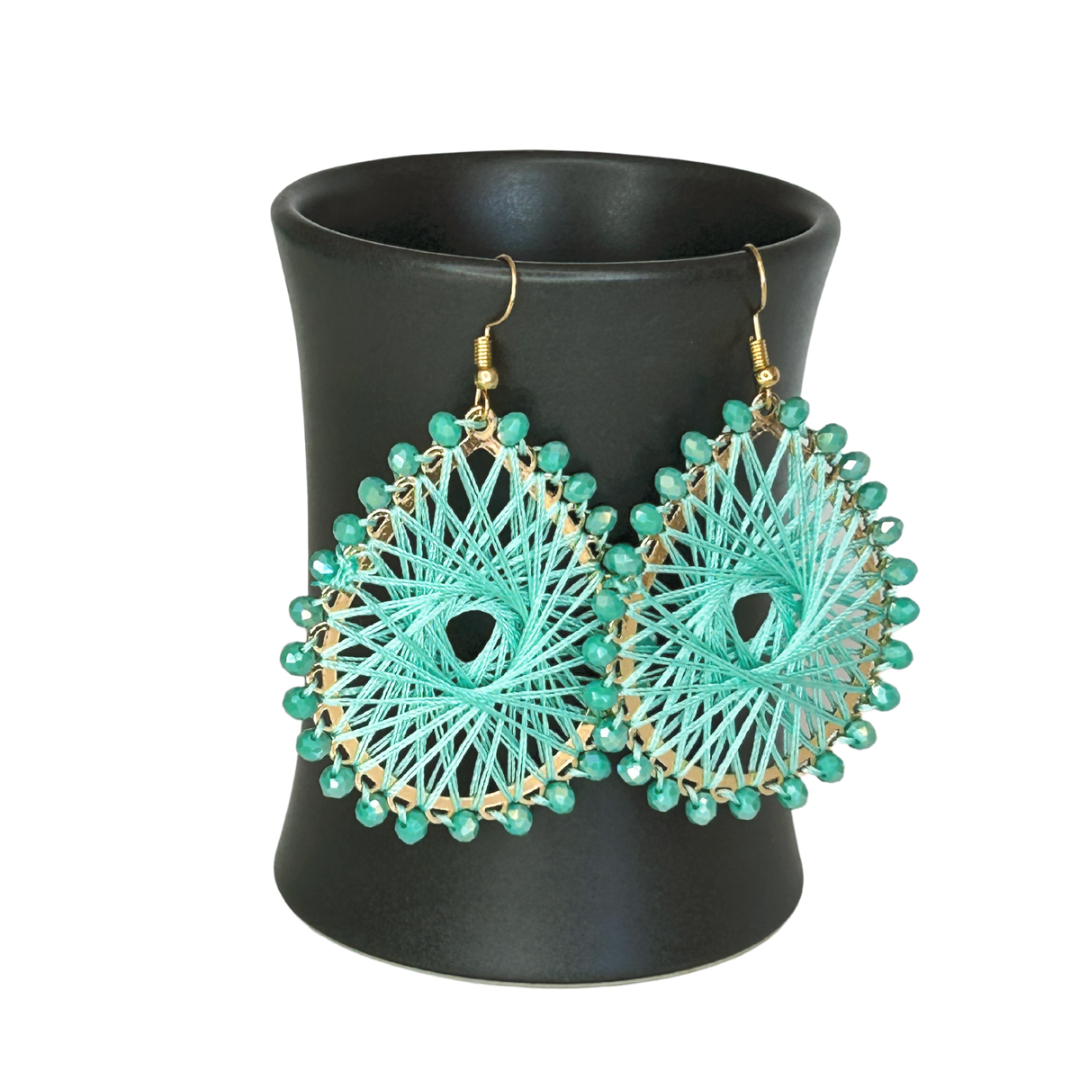 Angelco Accessories Colour burst teardrop earrings hanging on ceramic cup on white background - mint