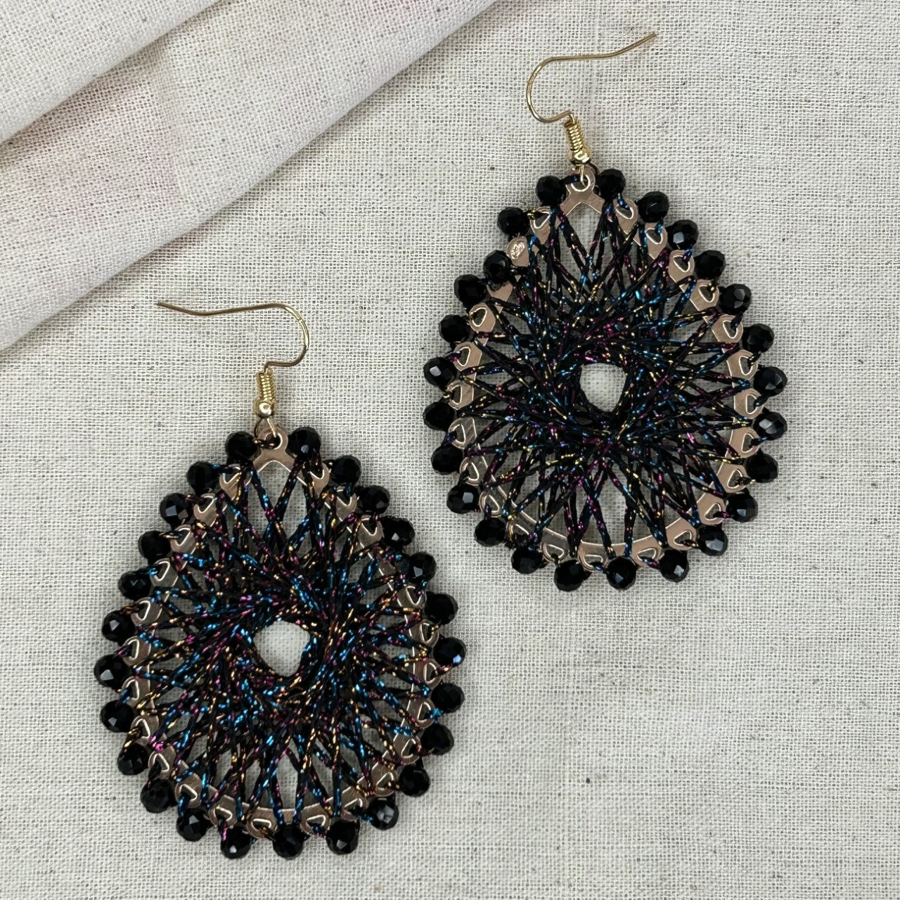 Angelco Accessories Colour burst teardrop earrings on linen background - black colourful